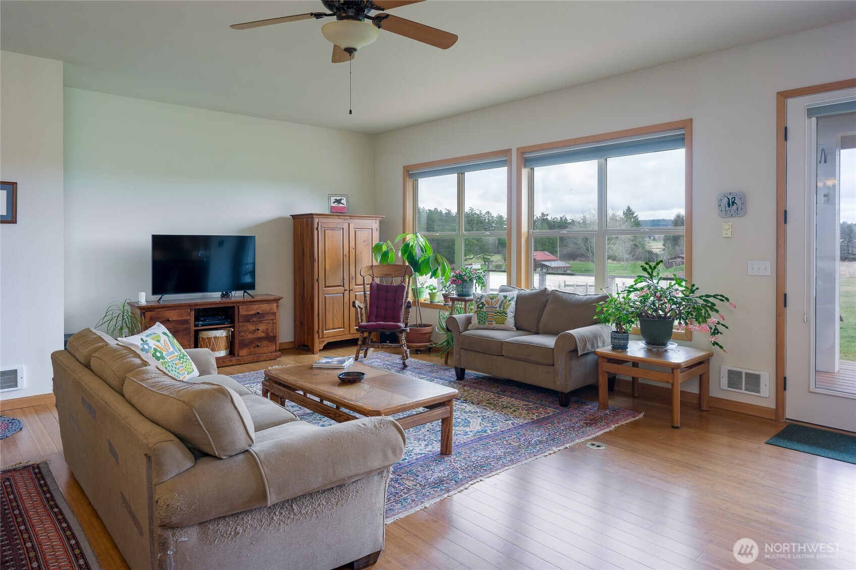 110 Clay Hill Road Lopez Island, WA 98261 - Photo 4 of 35 a living room with furniture and a flat screen tv
