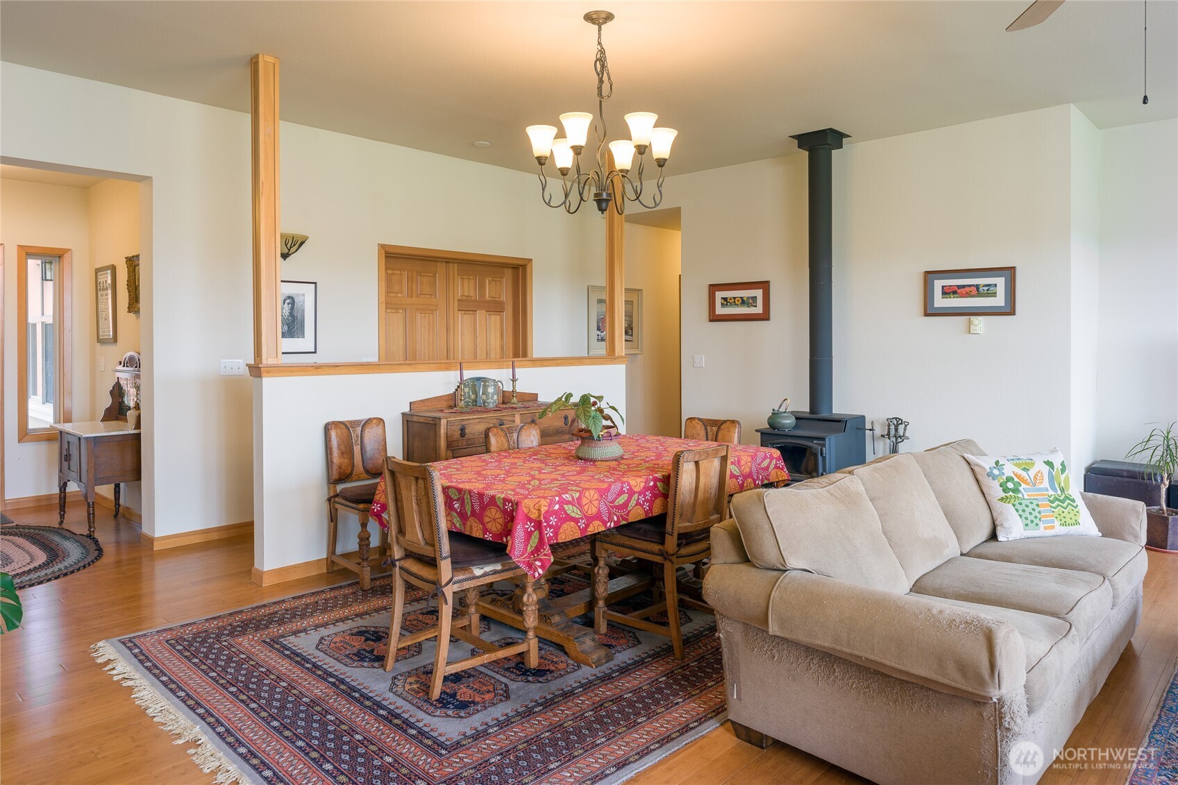 110 Clay Hill Road Lopez Island, WA 98261 - Photo 5 of 35 a living room with furniture a chandelier and a table