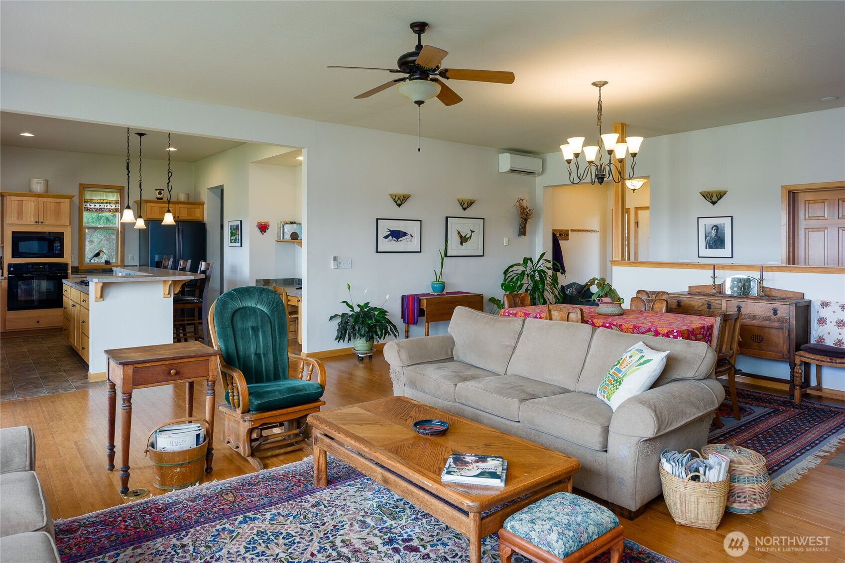 110 Clay Hill Road Lopez Island, WA 98261 - Photo 7 of 35 a living room with furniture a chandelier and a dining table