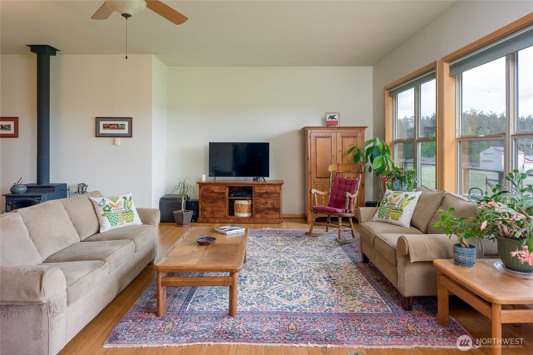 110 Clay Hill Road Lopez Island, WA 98261 - Photo 8 of 35 a living room with furniture a rug and a flat screen tv