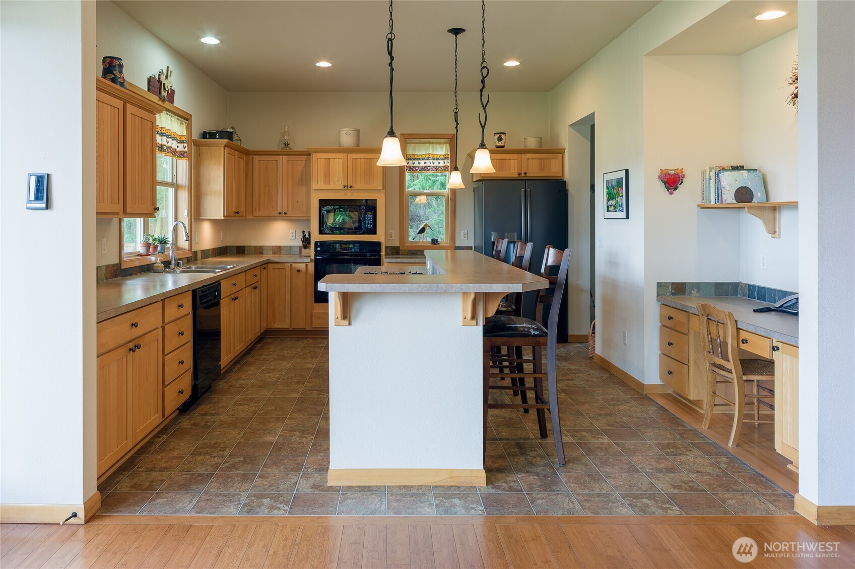 110 Clay Hill Road Lopez Island, WA 98261 - Photo 9 of 35 a large kitchen with kitchen island a sink a stove and a refrigerator