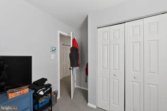 a room that has a bed and a closet