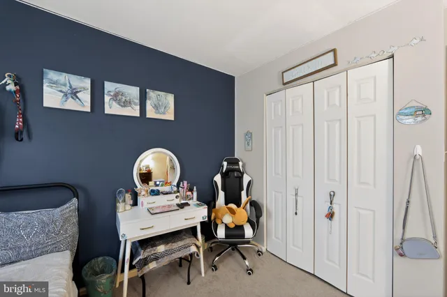 a view of a workspace room with table and chair