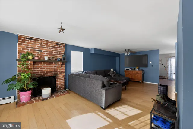 a bed room with furniture and a fireplace