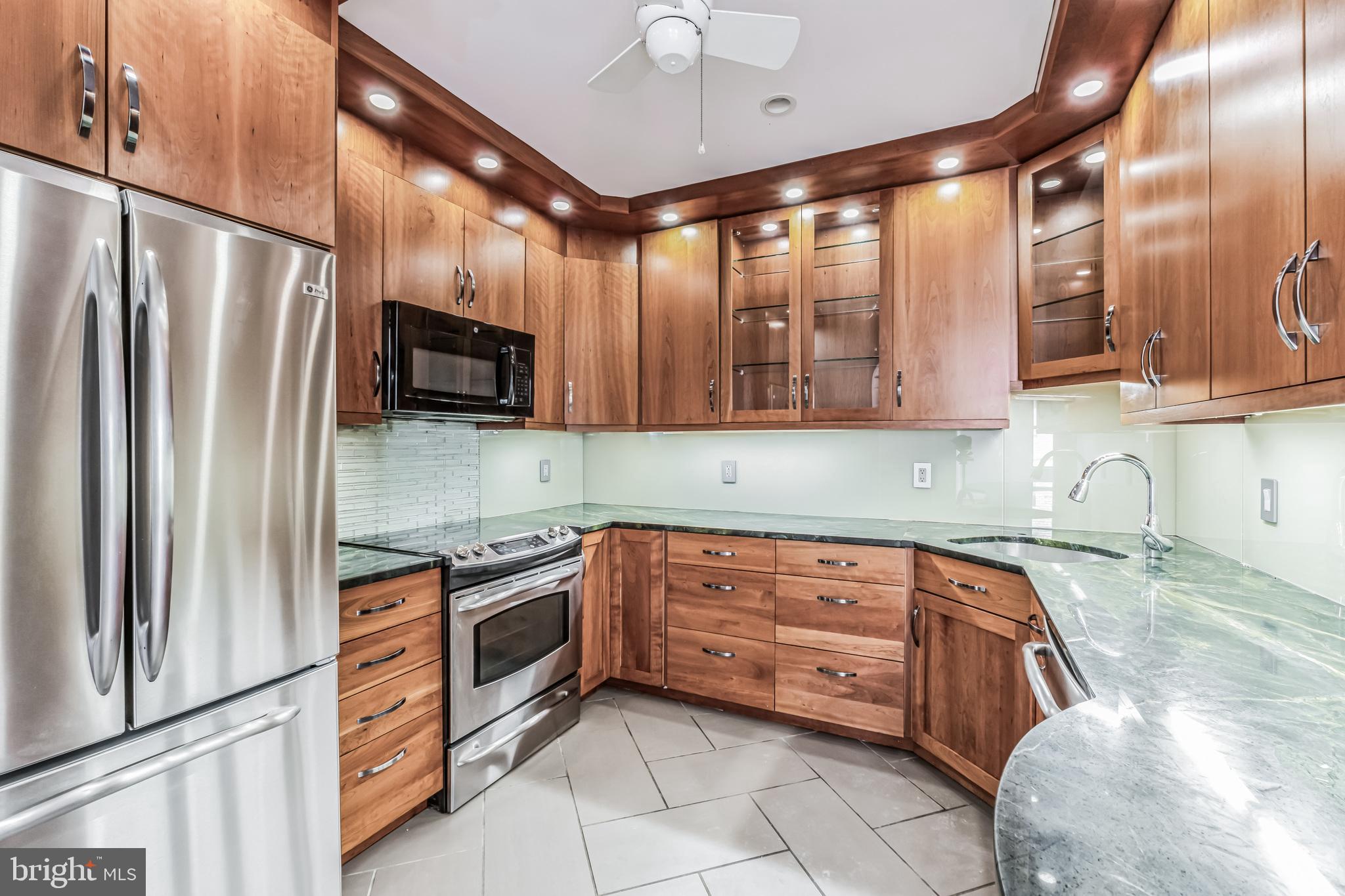 2123 California Street Northwest, Unit C6 Washington, DC 20008 - Photo 13 of 32 Custom kitchen with stainless and granite