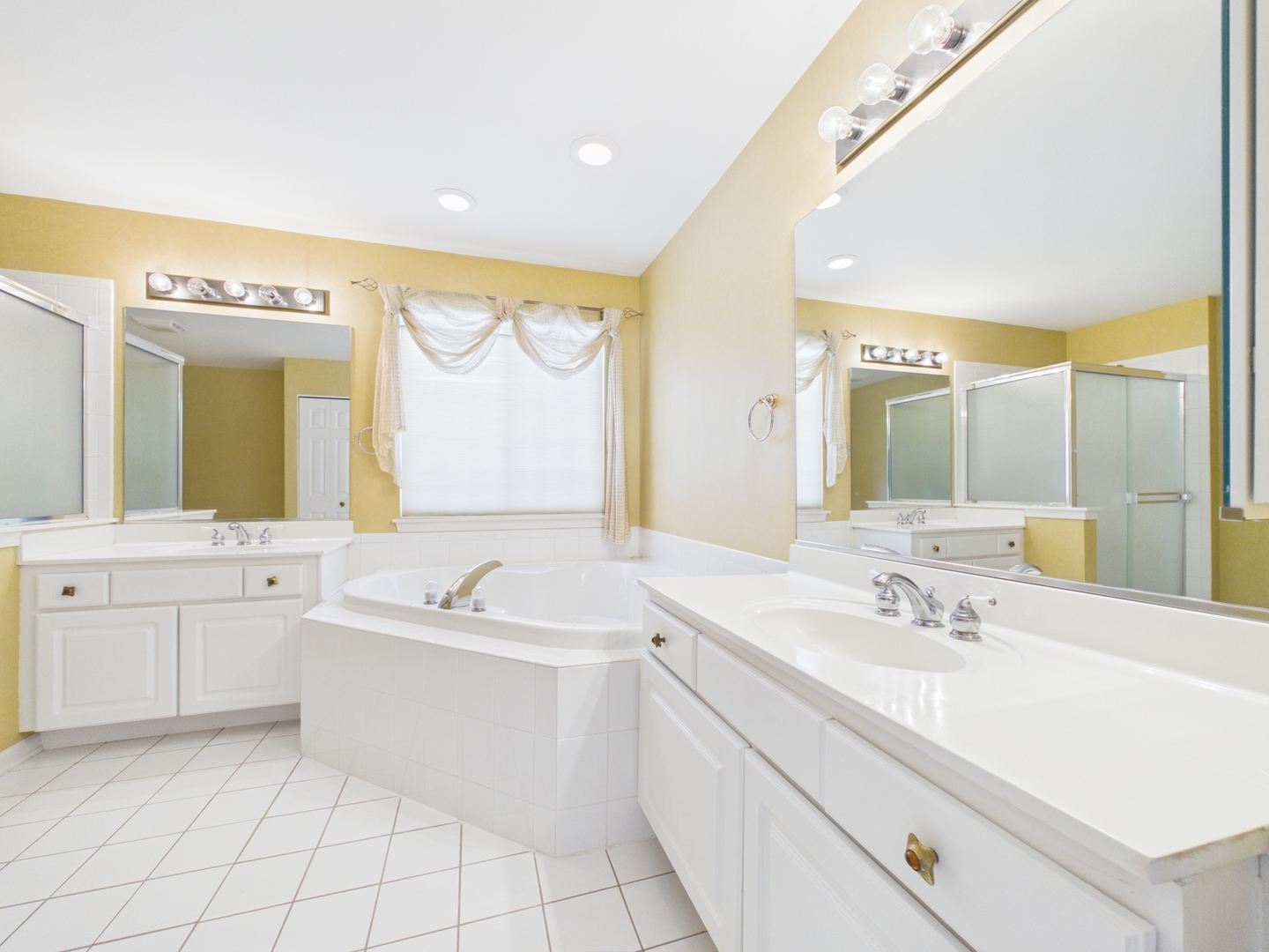 7486 Abbey Road Gurnee, IL 60031 - Photo 22 of 35 a spacious bathroom with a double vanity sink mirror and bathtub