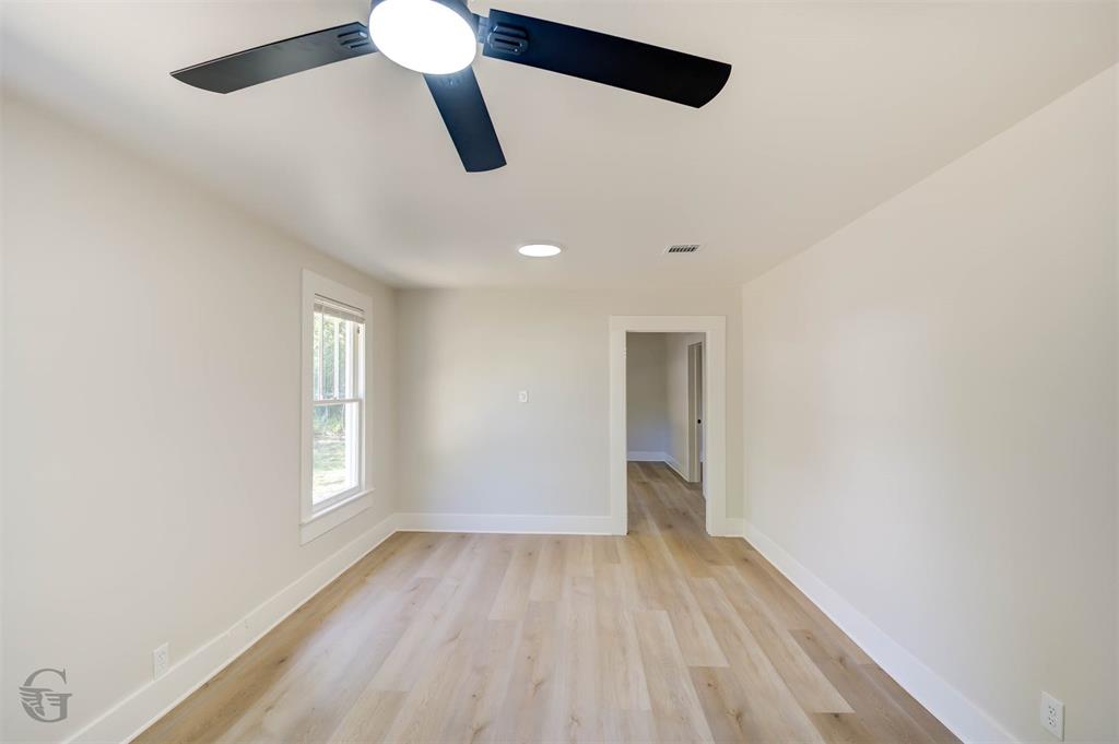 510 Constable Street Minden, LA 71055 - Photo 4 of 18 a view of empty room with wooden floor and fan