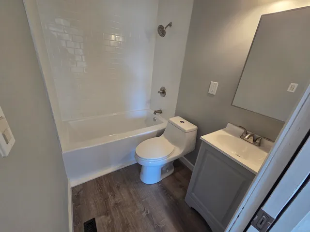 a bathroom with a toilet a sink and a bathtub