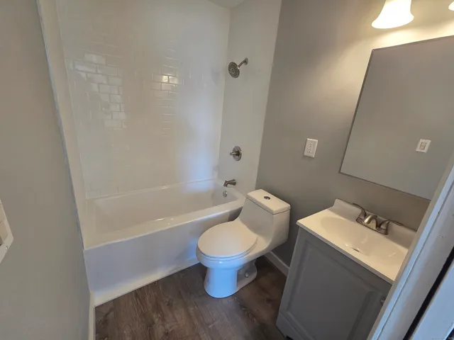 a view of an entryway with wooden floor