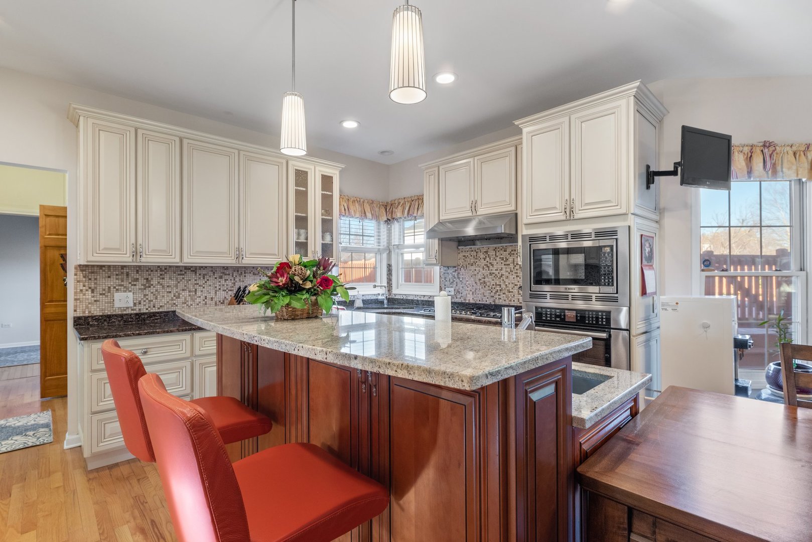 2527 Wild Timothy Road Naperville, IL 60564 - Photo 11 of 38 a kitchen with stainless steel appliances granite countertop a table chairs sink and cabinets