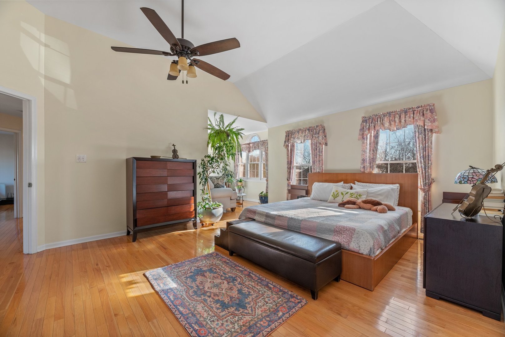 2527 Wild Timothy Road Naperville, IL 60564 - Photo 18 of 38 a bedroom with a bed dresser and a rug