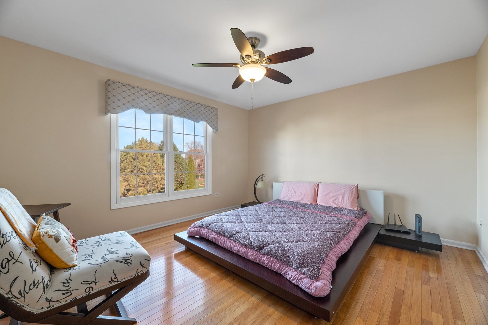 2527 Wild Timothy Road Naperville, IL 60564 - Photo 22 of 38 a bedroom with a bed and window