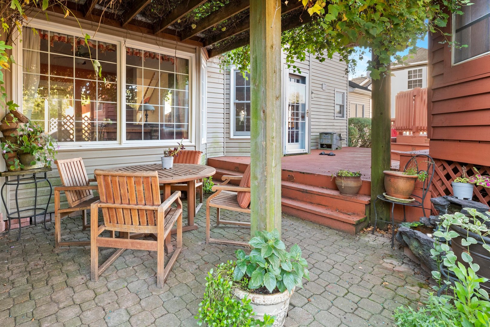 2527 Wild Timothy Road Naperville, IL 60564 - Photo 30 of 38 a backyard of a house with table and chairs