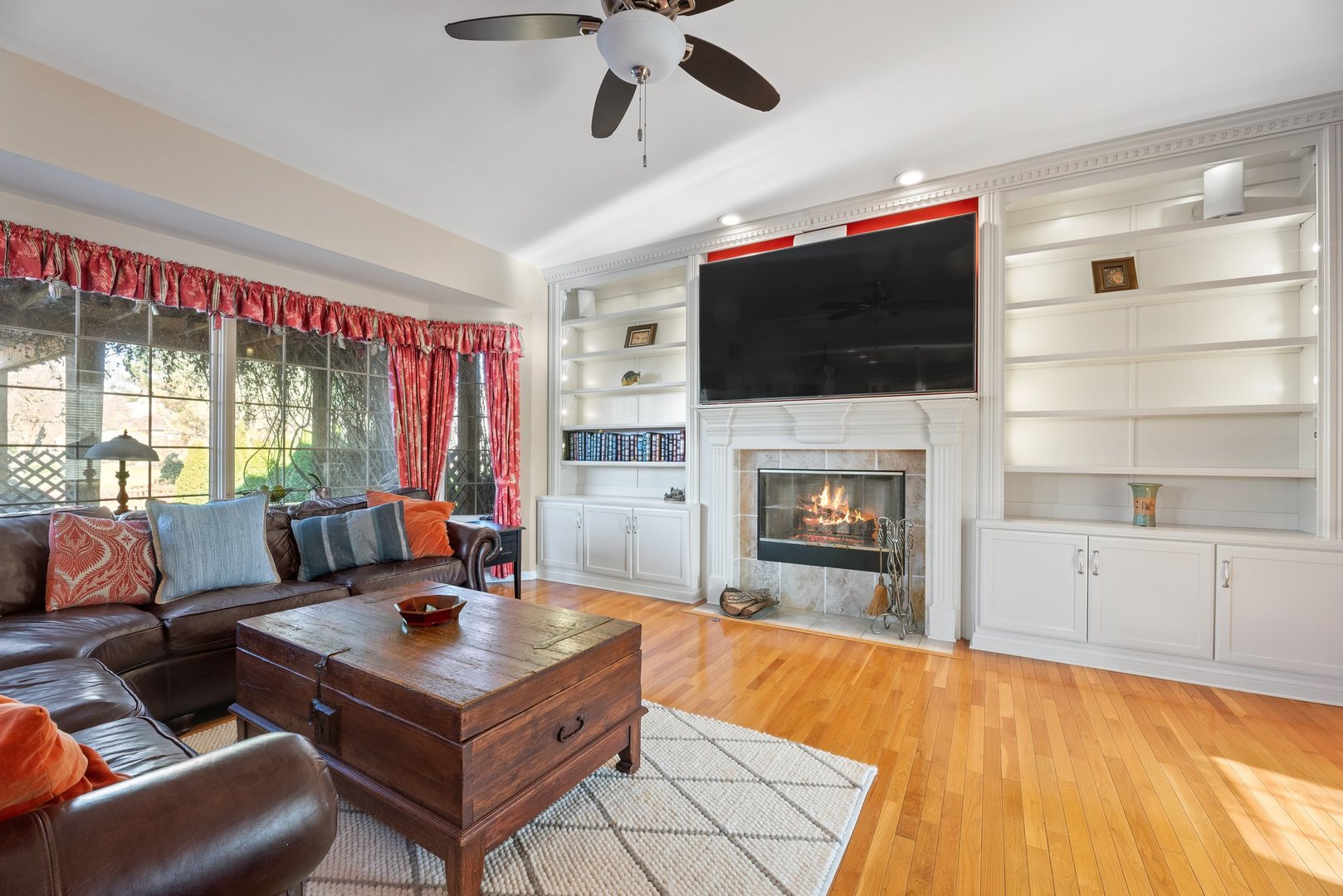 2527 Wild Timothy Road Naperville, IL 60564 - Photo 9 of 38 a living room with furniture a flat screen tv and a fireplace