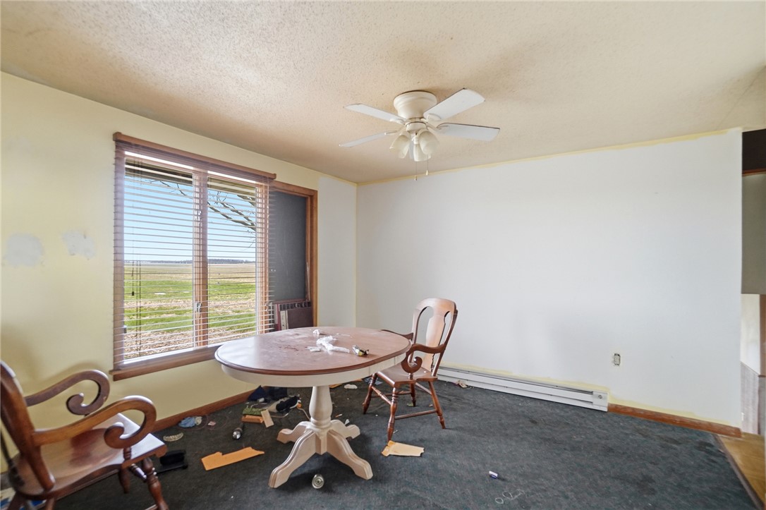 9750 Middlepoint Road Middle Point, OH 45863 - Photo 16 of 43 This bright room offers expansive views and versatile living space, perfect for any use.
