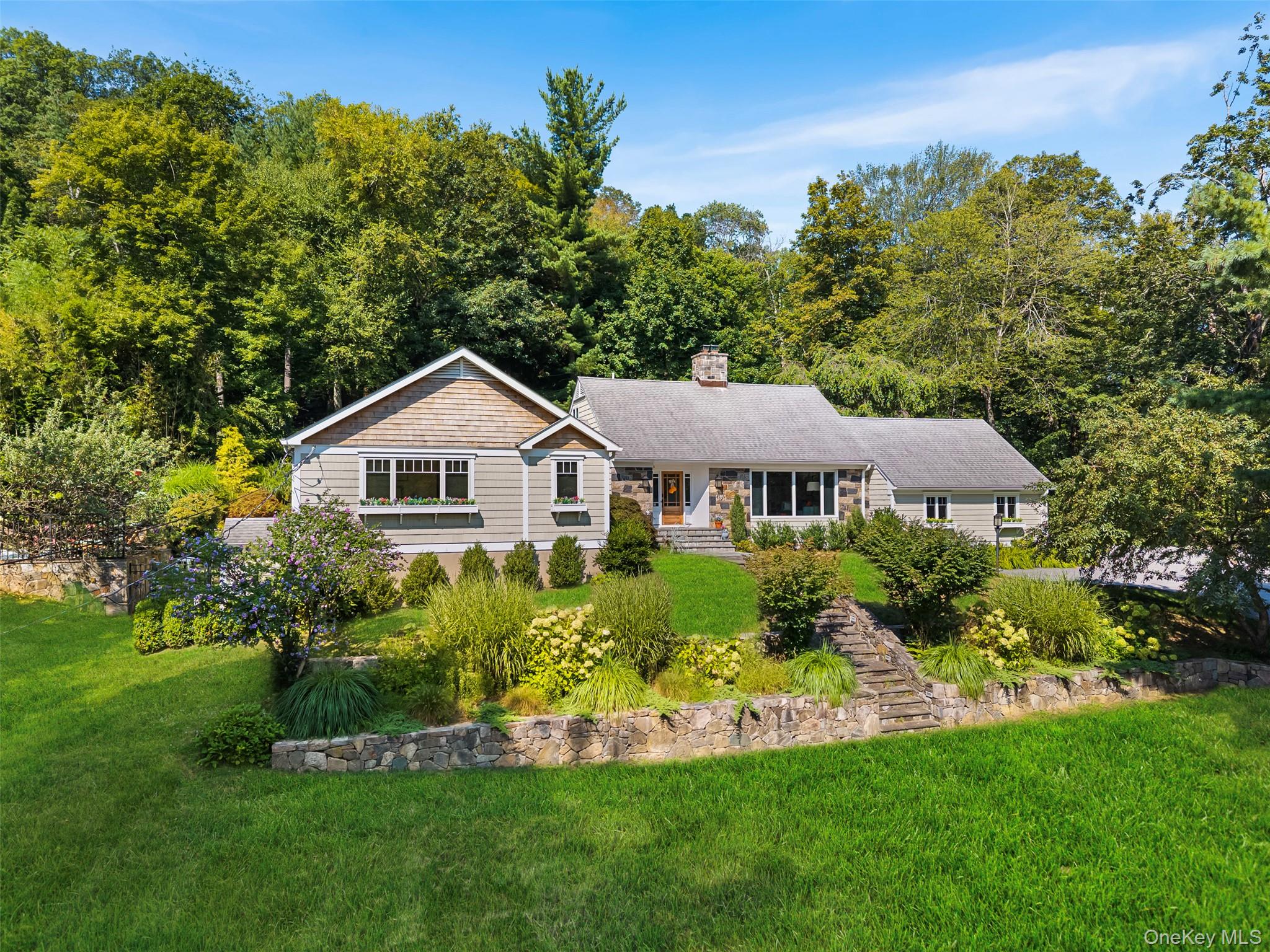 507 Croton Lake Road Bedford Corners, NY 10549 - Photo 1 of 39 a front view of a house with a yard and green space