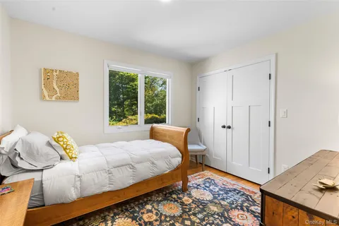 a bedroom with a bed and window