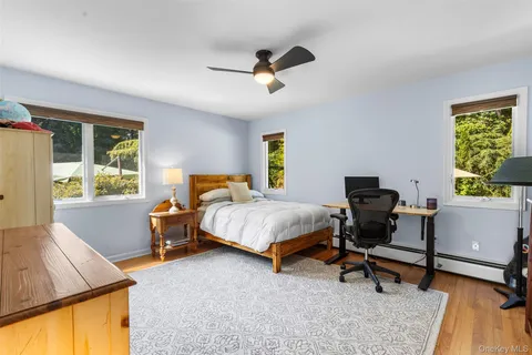 a bedroom with a bed and a desk