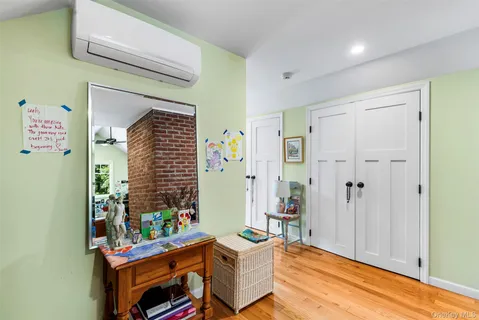 a bedroom with furniture and a window