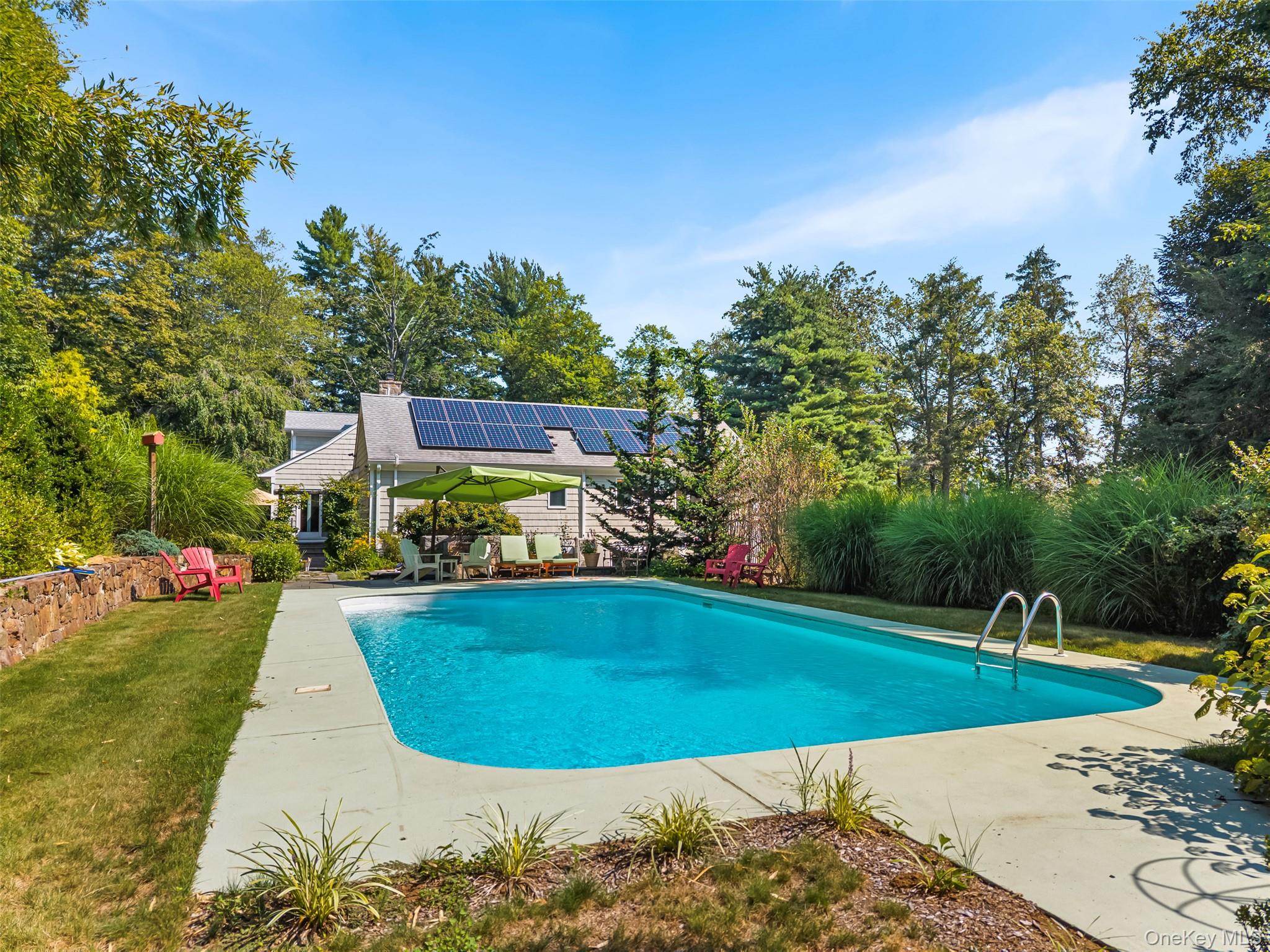 507 Croton Lake Road Bedford Corners, NY 10549 - Photo 32 of 39 a view of a swimming pool with a garden