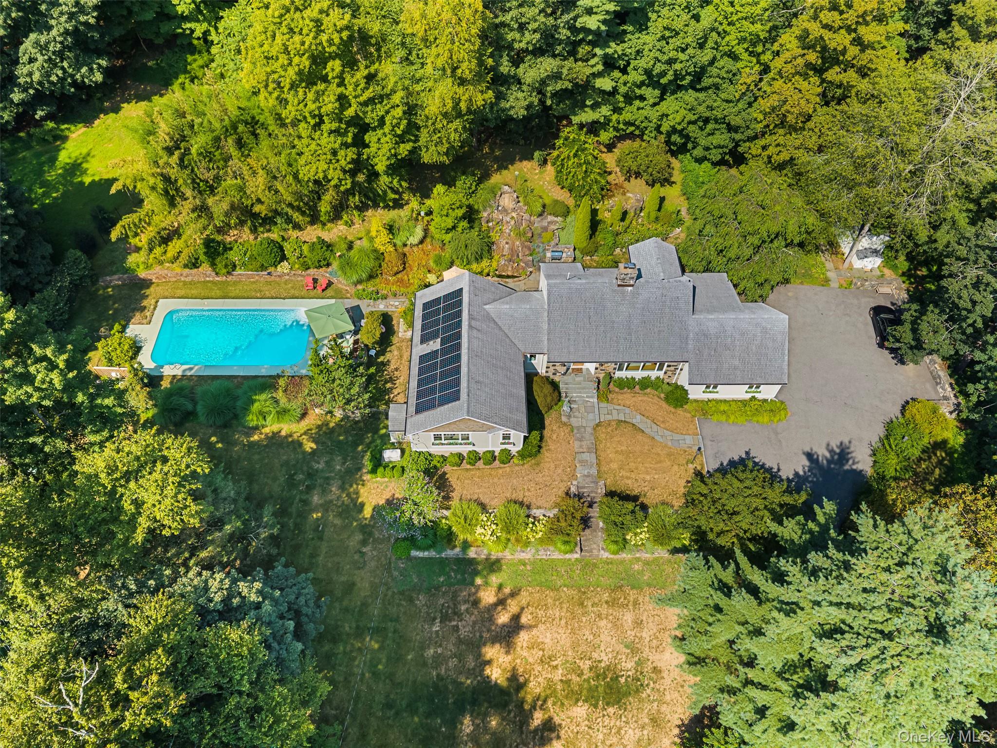 507 Croton Lake Road Bedford Corners, NY 10549 - Photo 34 of 39 an aerial view of a house with a yard swimming pool and outdoor seating