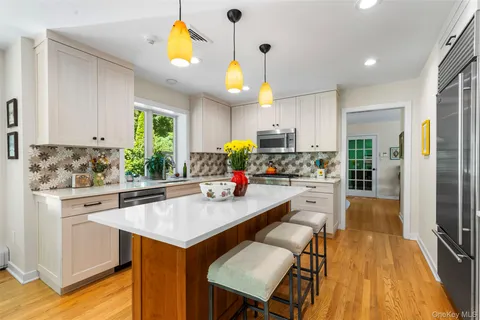 a kitchen with a sink appliances and cabinets