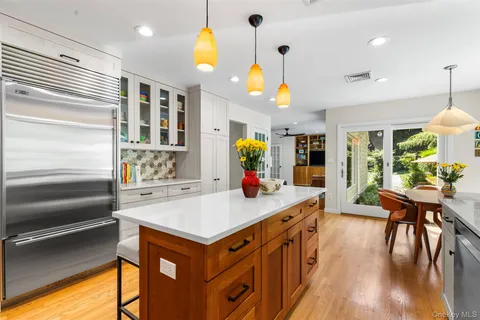 a kitchen with stainless steel appliances granite countertop a stove and a refrigerator