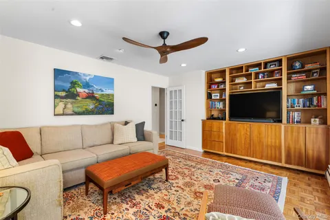 a living room with furniture and a rug