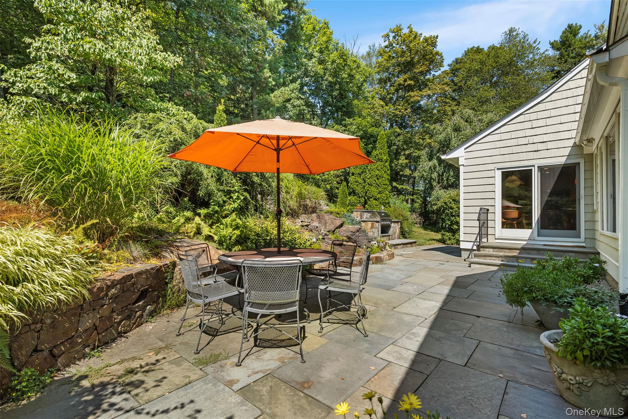 507 Croton Lake Road Bedford Corners, NY 10549 - Photo 10 of 39 a view of a backyard with sitting area and furniture
