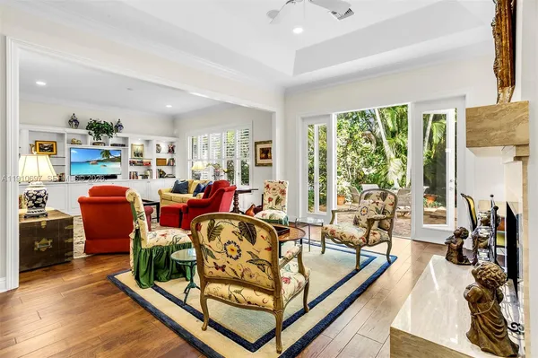 a very nice looking living room with furniture and a large window