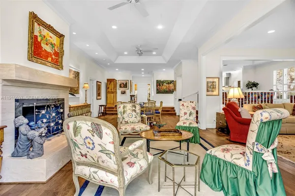 a living room with furniture a fireplace and a table