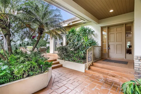 a view of house with porch