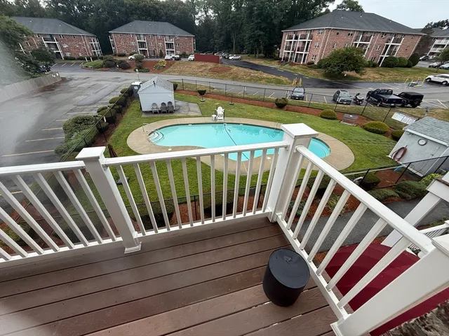 a view of swimming pool with outdoor seating and city view