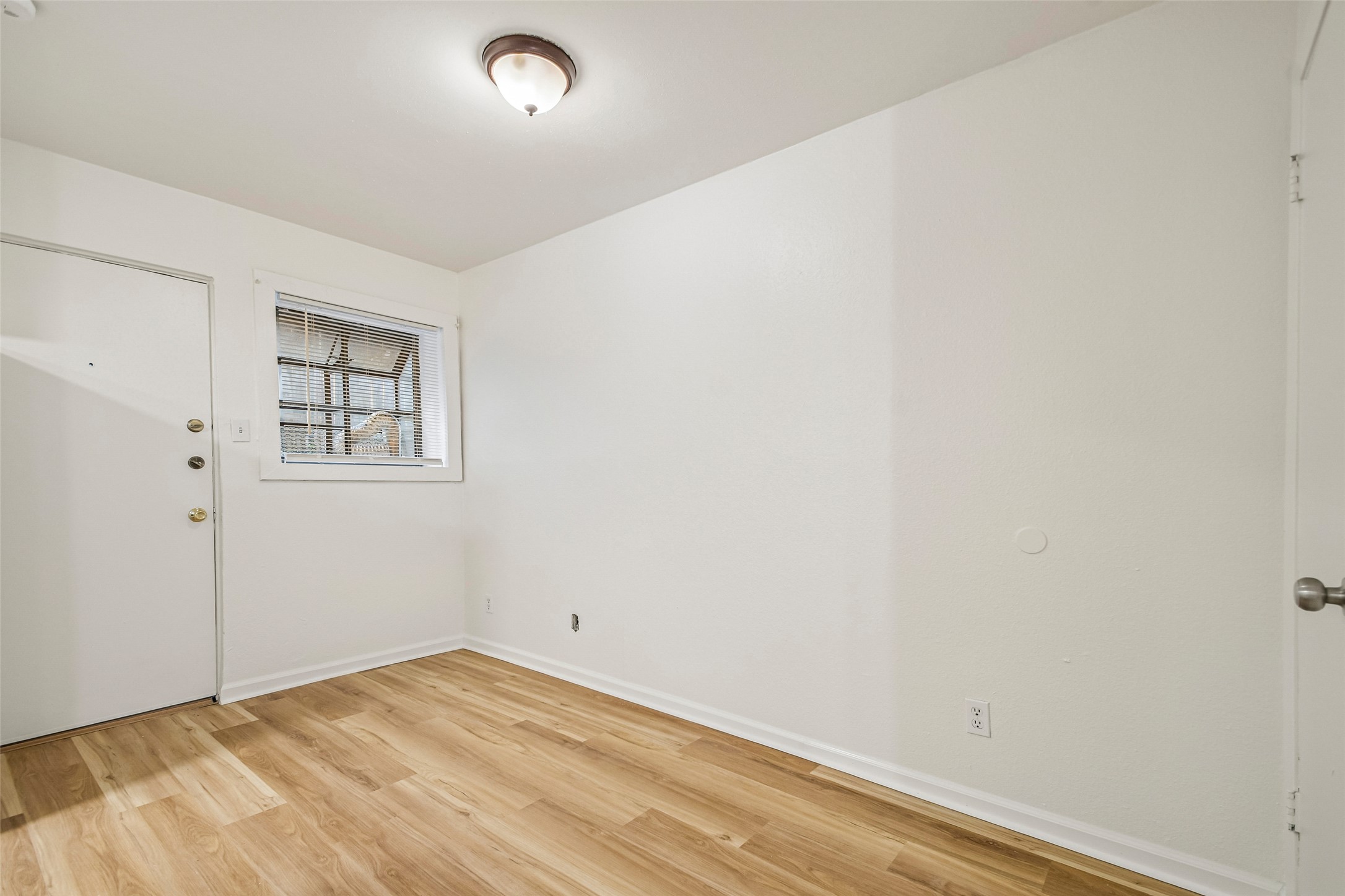 2413 Leon Street, Unit 104 Austin, TX 78705 - Photo 9 of 26 a view of empty room with windows