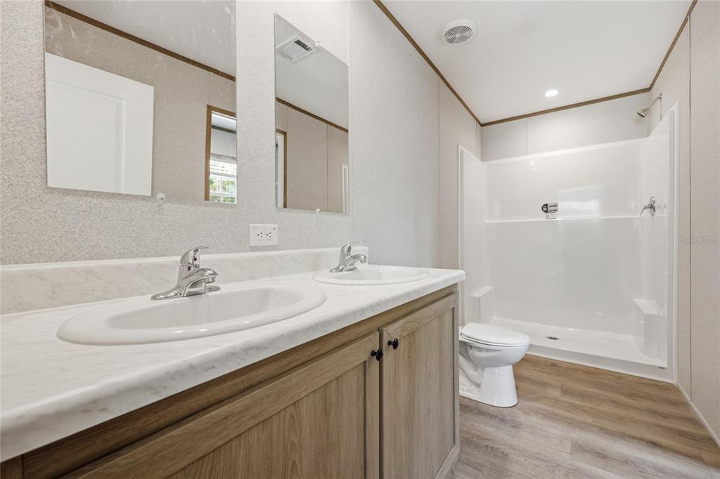 150 19th Street Interlachen, FL 32148 - Photo 17 of 30 a bathroom with a sink a toilet and shower