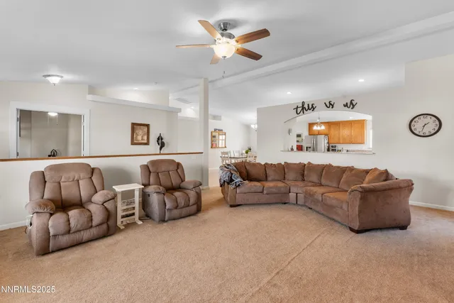a living room with furniture and white walls