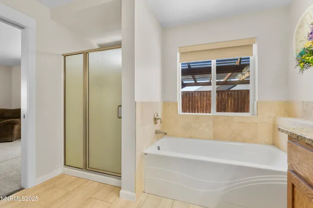 a bathroom with a bathtub and shower