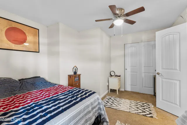 a bedroom with a bed and cabinets