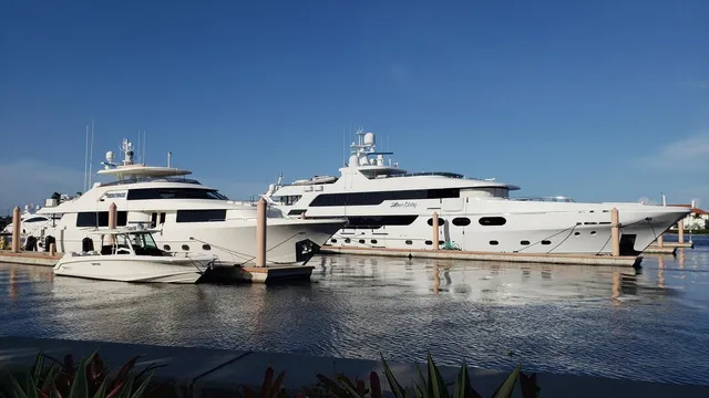 a view of a kitchen with stainless steel appliances granite countertop a stove and a white cabinets