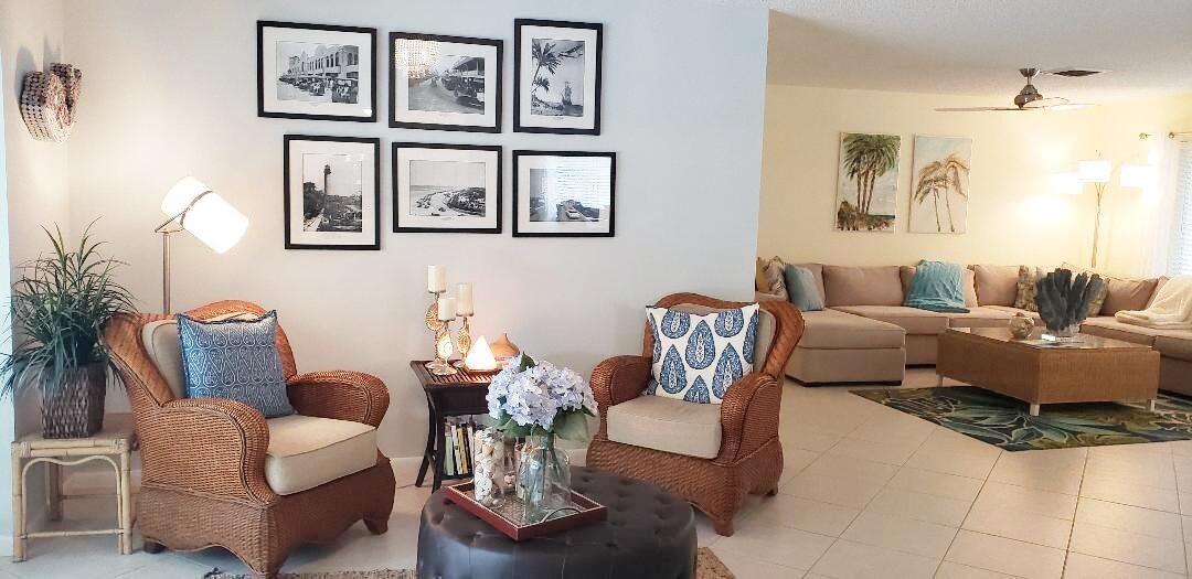 1150 Emerald Lane Singer Island, FL 33404 - Photo 3 of 19 a living room with furniture and painting on the wall