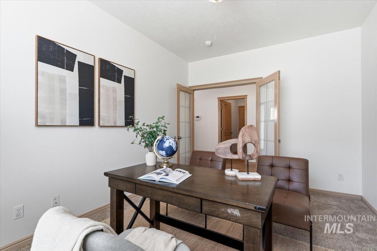 1183 North Buffalo Way Middleton, ID 83644 - Photo 23 of 47 Room featuring light-colored walls and carpet flooring