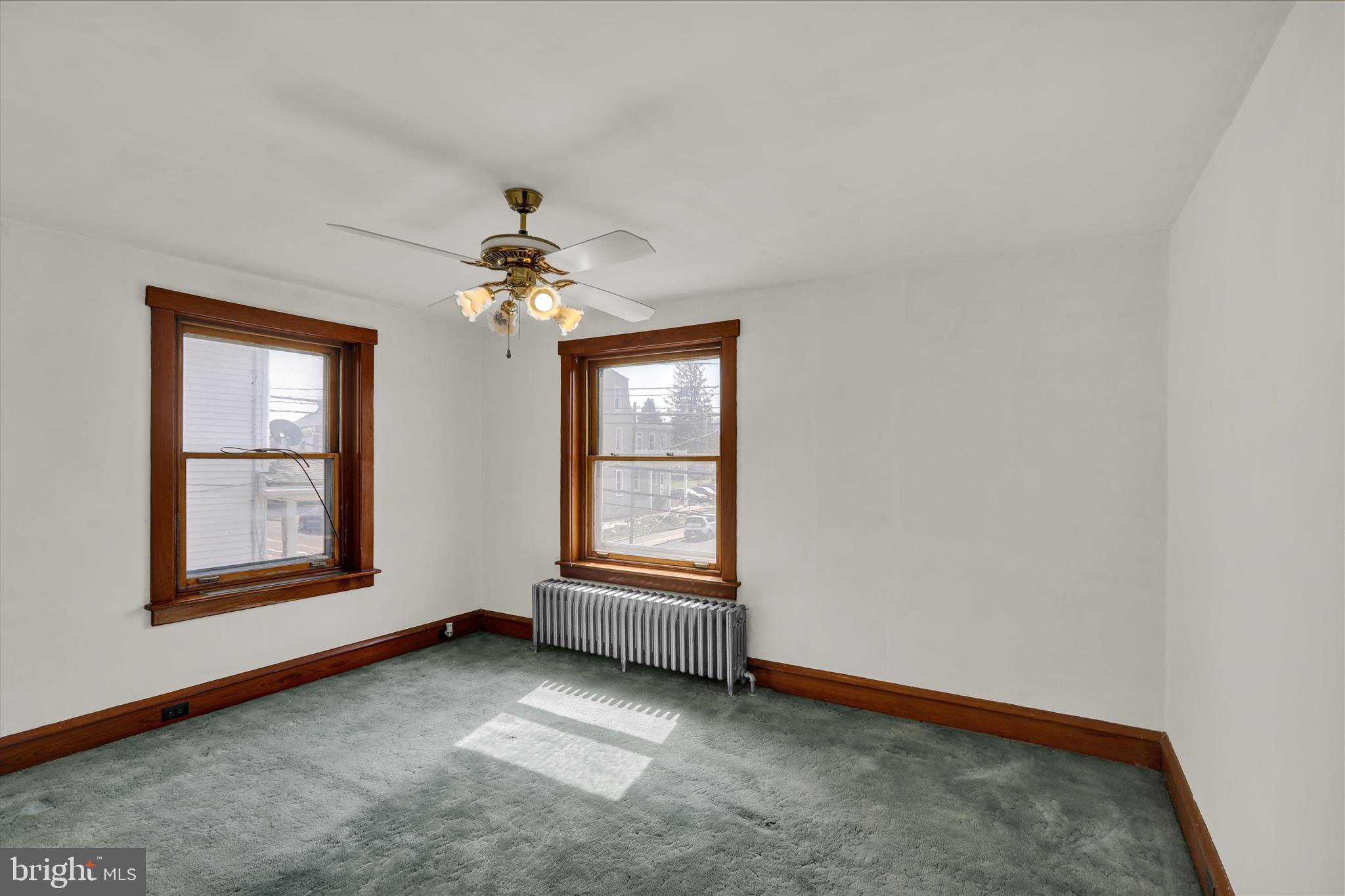 4205 Penn Avenue Reading, PA 19608 - Photo 24 of 54 an empty room with windows and chandelier fan