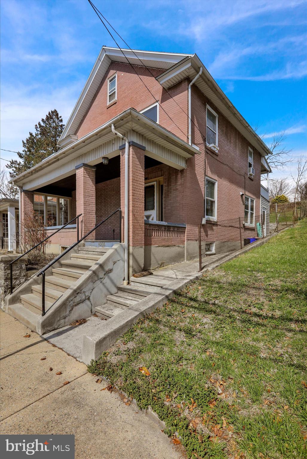 4205 Penn Avenue Reading, PA 19608 - Photo 4 of 54 a front view of a house with garden