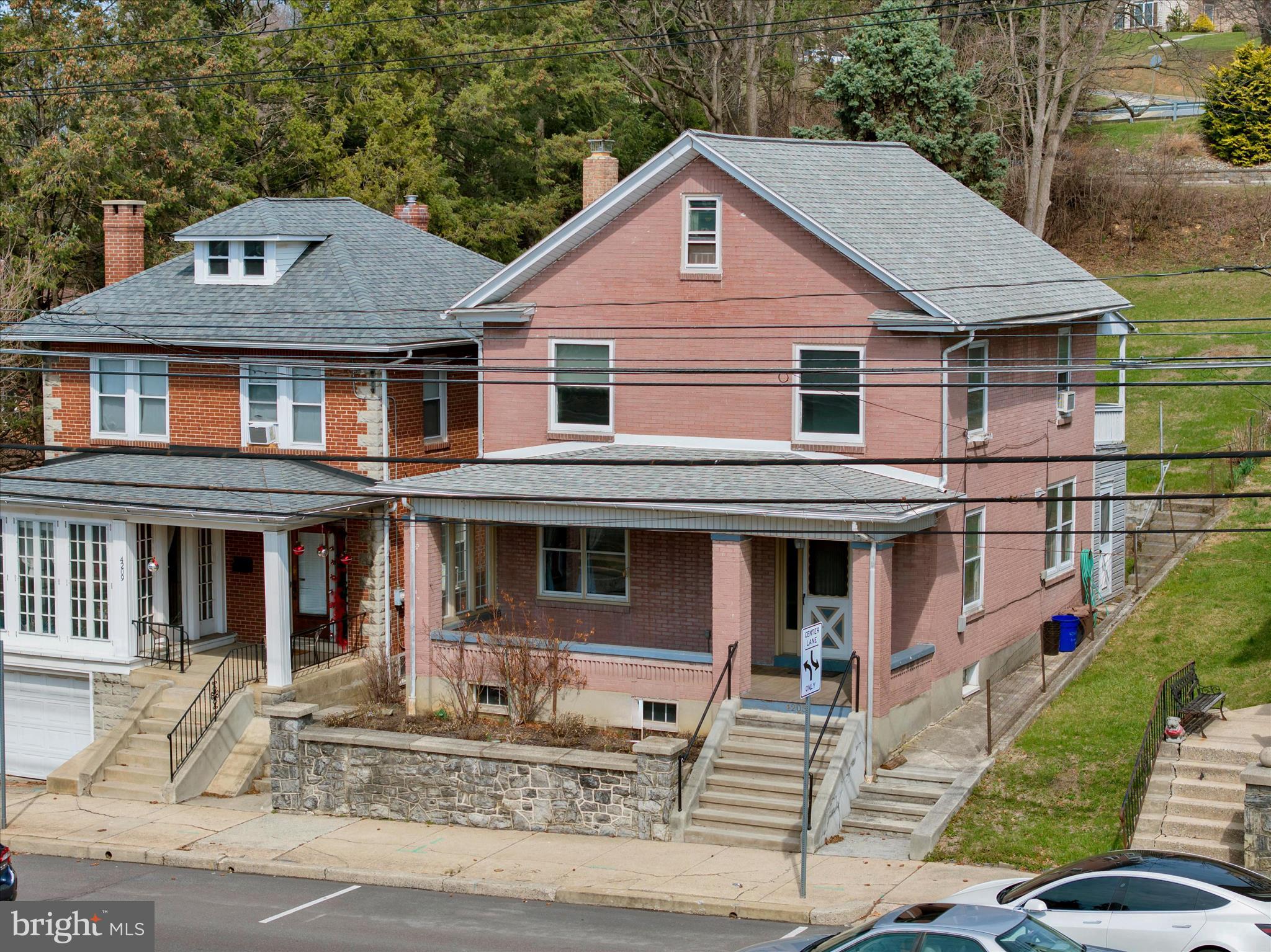 4205 Penn Avenue Reading, PA 19608 - Photo 5 of 54 a front view of a house with garden