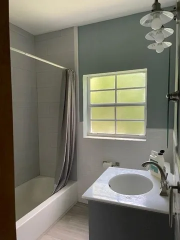 a bathroom with a sink and a bathtub