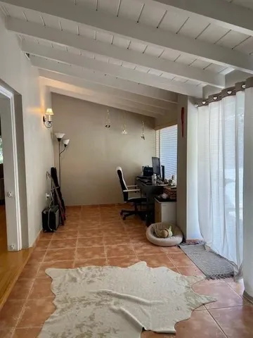 a room with a bed and a chandelier