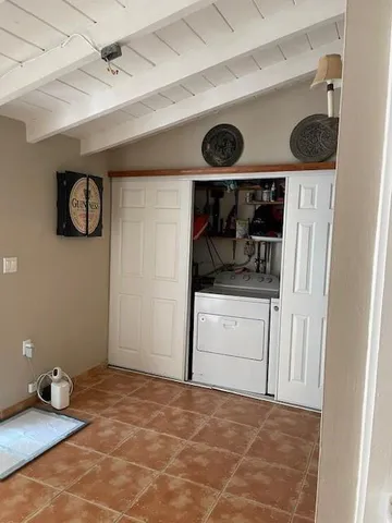 a view of storage and utility room with a fan