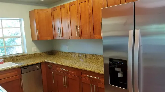 a kitchen with a sink and a window
