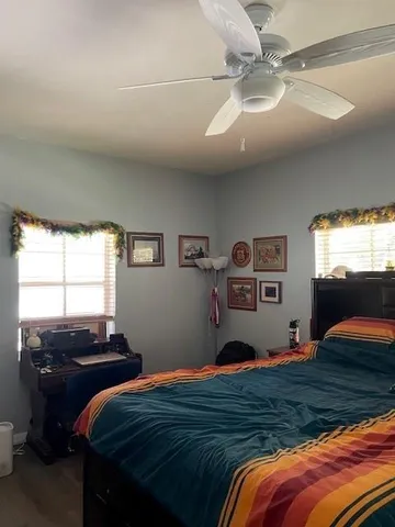 a bedroom with bed and window