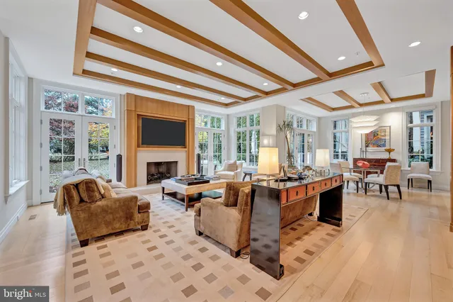 a lobby with furniture and floor to ceiling window